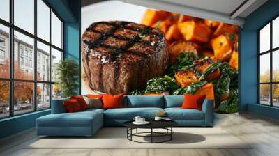 Grilled steak filet served with roasted sweet potatoes and sauteed greens on a white plate. Perfect for a healthy, delicious meal. Wall mural