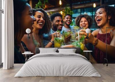 Multiracial friends enjoying happy hour toasting fresh mojito cocktails at open bar - Happy group of young people celebrating summer party together - Life style food and beverage concept Wall mural