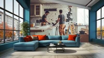 Two workers renovating a kitchen space with tools and materials around. Capturing home improvement and construction process. Wall mural