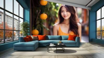 Asian woman model wearing an orange sundress in the garden Wall mural