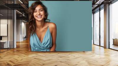 Indian woman model wear blue sundress isolated on pastel background Wall mural