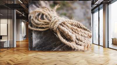 Old rope resting over old timber Wall mural