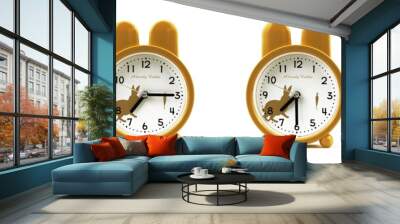 close up of a set of cute brown alarm clocks showing the time; 7, 7.15, 7.30 and 7.45 p.m or a.m. Isolated on white background
 Wall mural