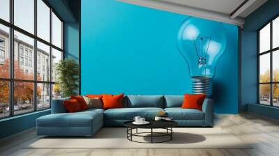 A Light Bulb Against a Blue Background Wall mural