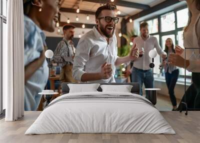 Man Dancing Joyfully at a Party with Friends Wall mural