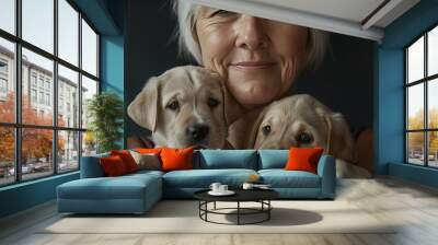 Portrait of a happy woman with two puppies Wall mural