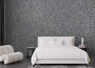 A frame filled with the textured surface of dry asphalt, showcasing the detailed pattern and composition under the sunlight on a clear day. Wall mural