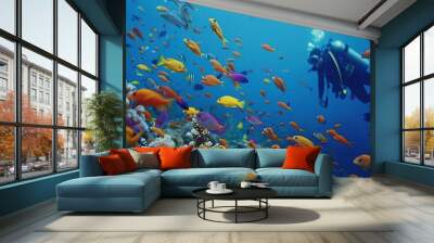 A Diver and a School of Colorful Fish in a Vibrant Coral Reef Wall mural