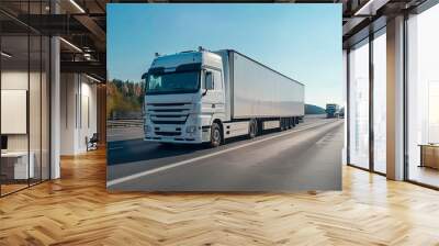 White Semi-Truck Driving on a Highway With a Clear Blue Sky Wall mural