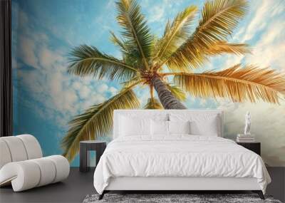 Coconut palm tree on sky background. Low Angle View. Toned image Wall mural