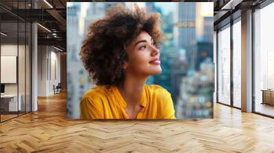 Afro business woman happy in modern office looking at the future Wall mural