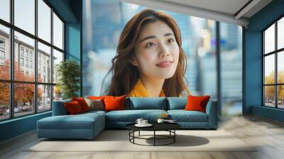 Asian business woman happy in modern office looking at the future Wall mural