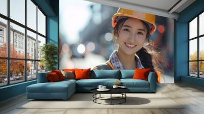 Asian woman wearing Construction worker uniform for safety on site Wall mural