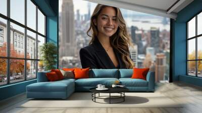 Hispanic businesswoman wearing black suit standing in modern office Wall mural