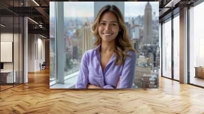 Hispanic businesswoman wearing purple formal shirt standing in modern office Wall mural