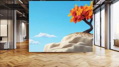 A solitary tree with vibrant orange leaves stands atop a rocky landscape under a clear blue sky, evoking tranquility and beauty. Wall mural