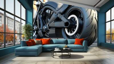 Close-up view of a sleek black motorcycle tire showcasing modern design and craftsmanship in urban surroundings. Wall mural