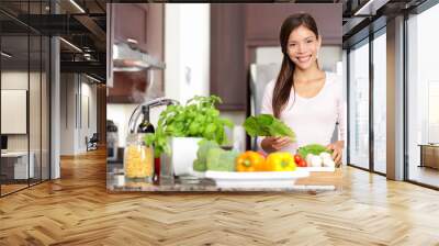 Woman cooking in new kitchen Wall mural