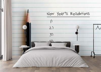 Pencil on lined note sheet paper with handwritten NEW YEAR'S RRESOLUTIONS - concept of making decision to change or improve life in the next coming year Wall mural