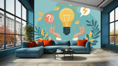 A bright yellow lightbulb is held by two hands, representing the discovery of an idea. The lightbulb is surrounded by leaves and symbols like question marks, representing a thinking process. Wall mural