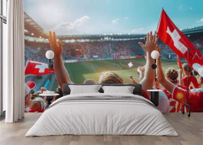 Switzerland football soccer fans in a stadium supporting the national team wearing red shirt, supporting , cheering and rising Switzerland national flag in european football league Wall mural