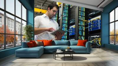 it technician with network equipment and tablet Wall mural