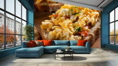 Scrambled eggs on a slice of bread. Wall mural