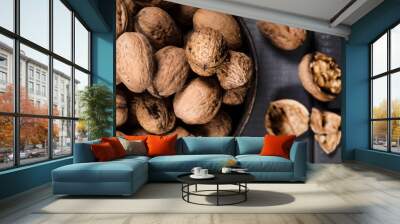 Whole nuts in a metal container. Wall mural