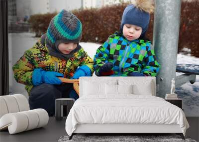 Children playing with snowball maker Wall mural