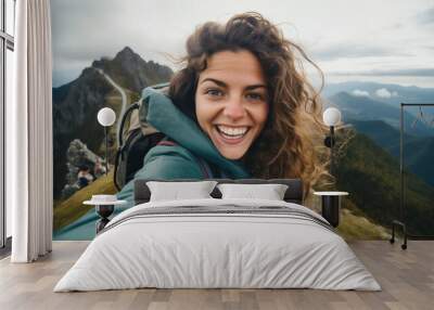 Young hiker beauty woman having fun taking selfie portrait on the top of mountain Wall mural