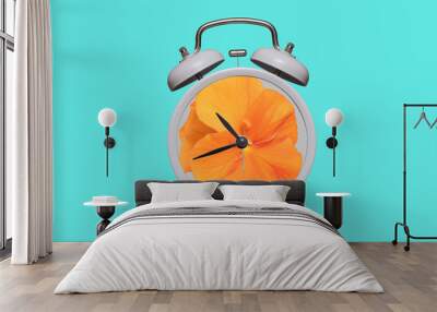 Old fashioned white alarm clock. Orange pansy instead of a dial Wall mural