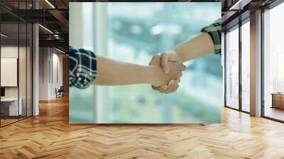 business people shaking hands for business merger teamwork Successful negotiations shake hands to celebrate partnership and business agreement ideas. Wall mural