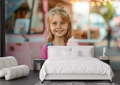 cute little girl holding ice cream in waffel cone; pink food truck in park Wall mural