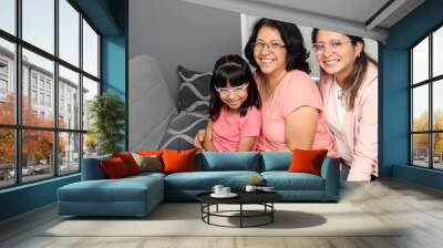 Brunette Latina grandmother is pampered by her daughter and granddaughter, they take care of each other as a support network and celebrate Grandparents' Day Wall mural