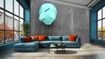 zenith view of turquoise blue piggy bank on vintage gray background Wall mural