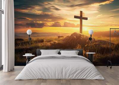 A cross standing on a grassy field during a serene sunset, perfect for Ascension Day and Easter religious concepts emphasizing faith and spirituality. Wall mural