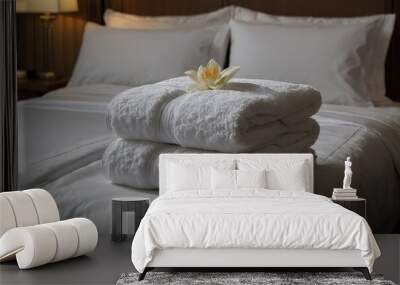 towels stacked on top of each other on a bed. Hospitality Wall mural