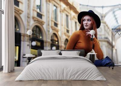 Woman pose for a portrait outside of the Galleria Vittorio Emanuele II in Milano Italy Wall mural