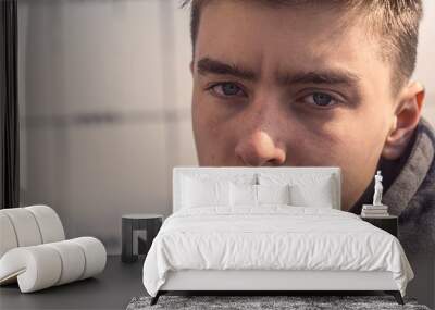 close up portrait of a young serious man Wall mural