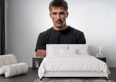 portrait of a young man with crossed arms, isolated on white Wall mural