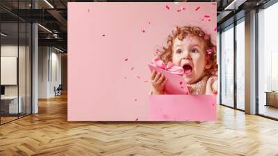 Little girl surprised by birthday gift Wall mural