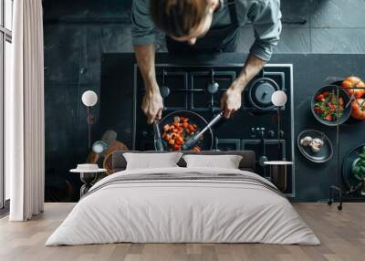 Top view of chef cooking tomatoes on stovetop Wall mural