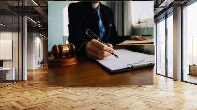 Business and lawyers discussing contract papers with brass scale on desk in office. Law, legal services, advice, justice and law concept picture with film grain effect Wall mural