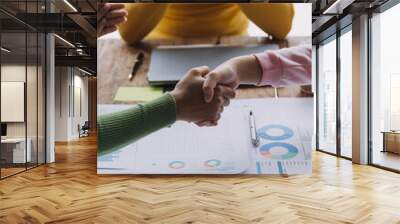 Business handshake for teamwork of business merger and acquisition,successful negotiate,hand shake,two businessman shake hand with partner to celebration partnership and business deal concept Wall mural