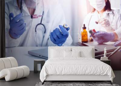 Health care researchers working in life science laboratory and analyzing microscope slides in research lab. New Epidemic Corona Virus. Corona virus outbreaking. Wall mural