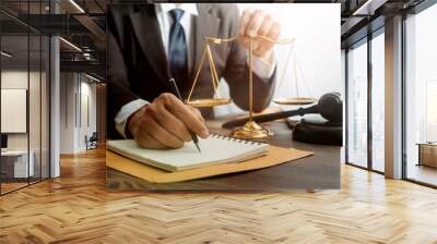 justice and law concept.Male judge in a courtroom on wooden table and Counselor or Male lawyer working in office. Legal law, advice and justice concept. Wall mural