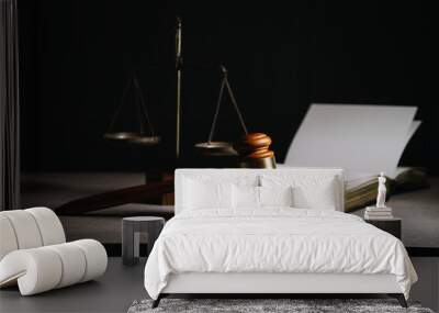 Justice and law concept.Male judge in a courtroom with the gavel, working with, computer and docking keyboard, eyeglasses, on table in morning light Wall mural