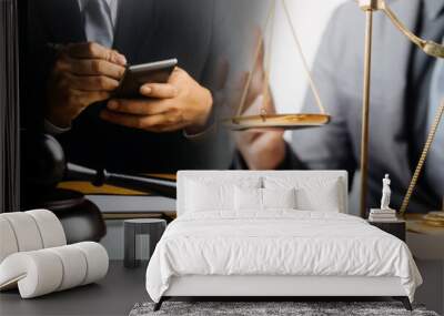 Justice and law concept.Male judge in a courtroom with the gavel, working with, computer and docking keyboard, eyeglasses, on table in morning light Wall mural