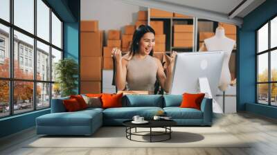 Successful Woman start up online seller at workplace. small business entrepreneur SME or freelance asian woman working with box at home. Wall mural