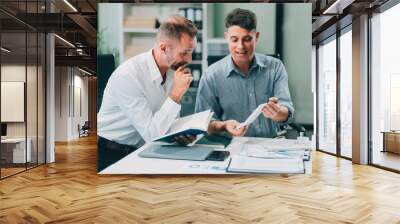 Two businessmen working together Analyze financial reports with charts and graphs while using the calculator to calculate budget, income, taxes, business growth. Startup business idea. Wall mural